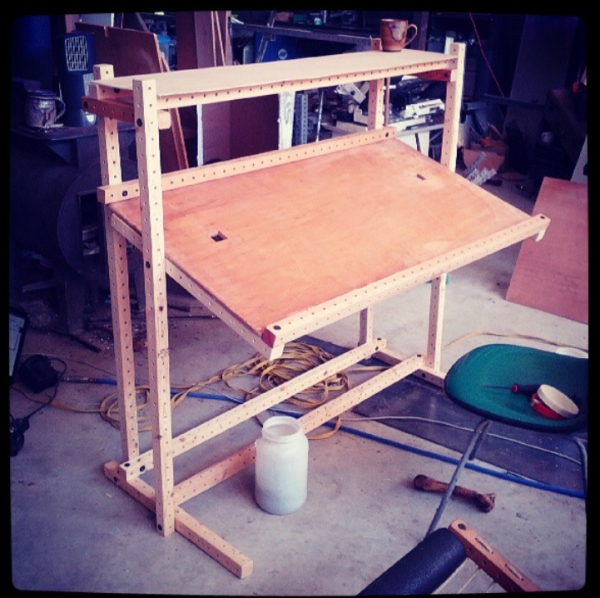 I designed this drafting table at Summit Station in Willits, CA. It uses no more parts than a flat desk of similar construction, but offers adjustable height and tilt, and a pen rest. It makes use of the shelf joints" loading="lazy"> discovered by [[Joy Livingwell . I used Phil and RJ Jergenson's Gridbeam system, which favored frame lengths of 1ft, 2ft, 3ft, and so on. And allowed odd lengths. Consequently, the vertical beam has 32 holes. -- User:Tim ) Adapter plates VESA mount ATX mount Drafting table